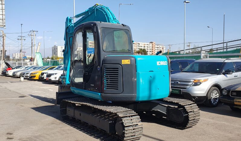 
								Kobelco 60 SR lleno									