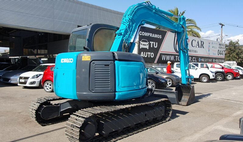 
								Kobelco 60 SR lleno									