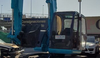 
										Kobelco 60 SR lleno									