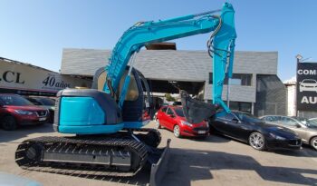 
										Kobelco 60 SR lleno									